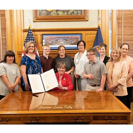 Members of the North Central Kansas Down Syndrome Society at the ceremonial signing for the Kansas Down Syndrome Awareness distinctive license plate